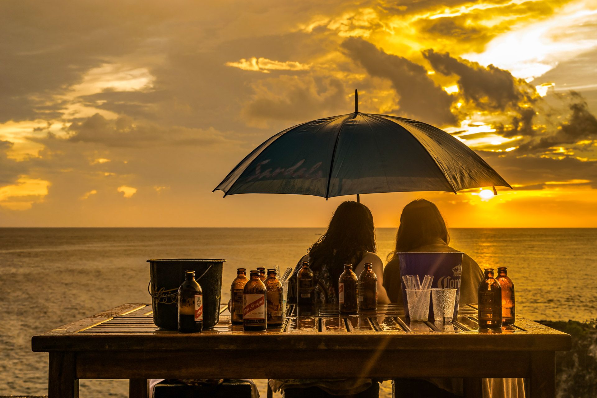 Couple-watching-sunset-at-Ricks-s-Cafe-Negril