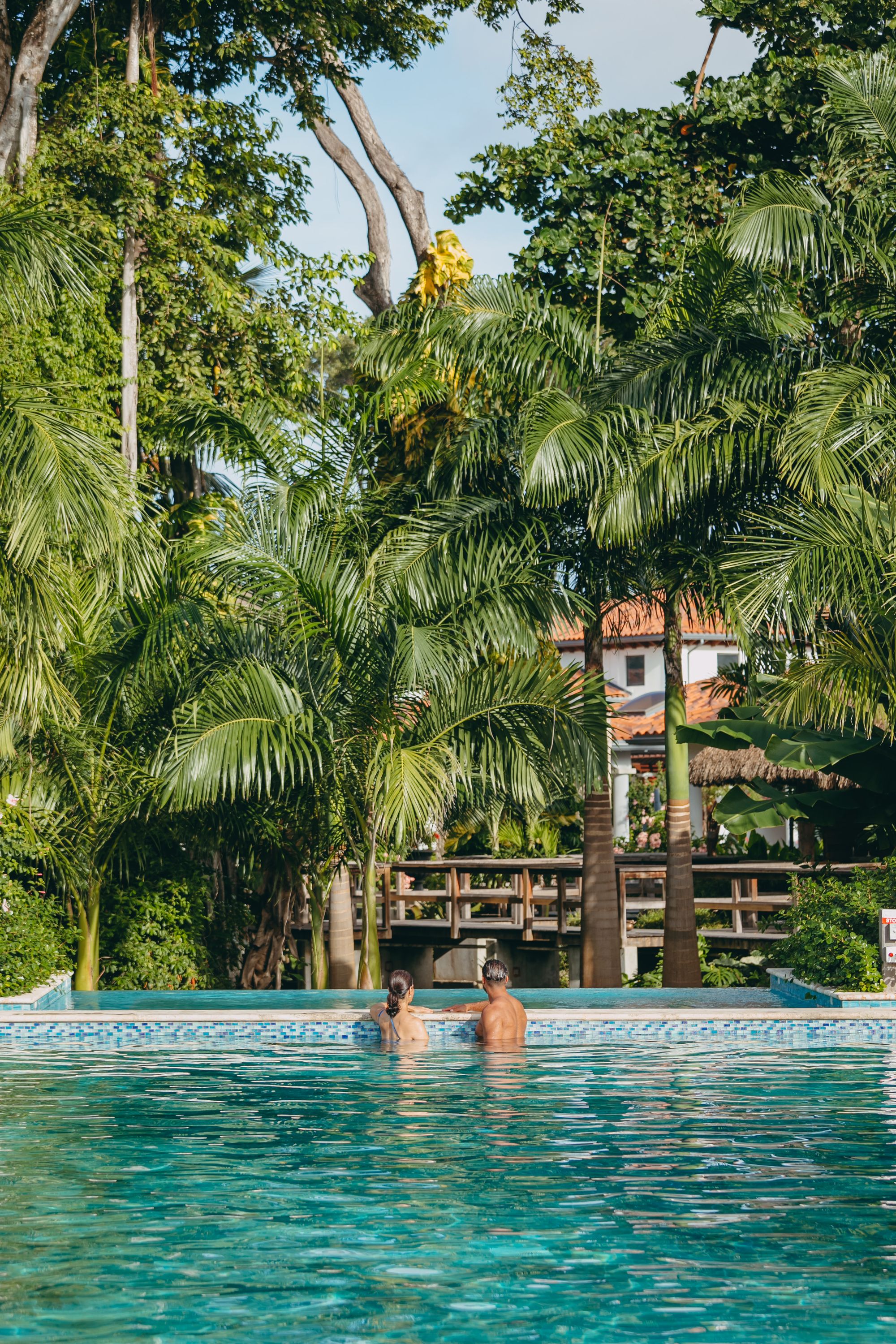 couple in a pool at sandals barbados