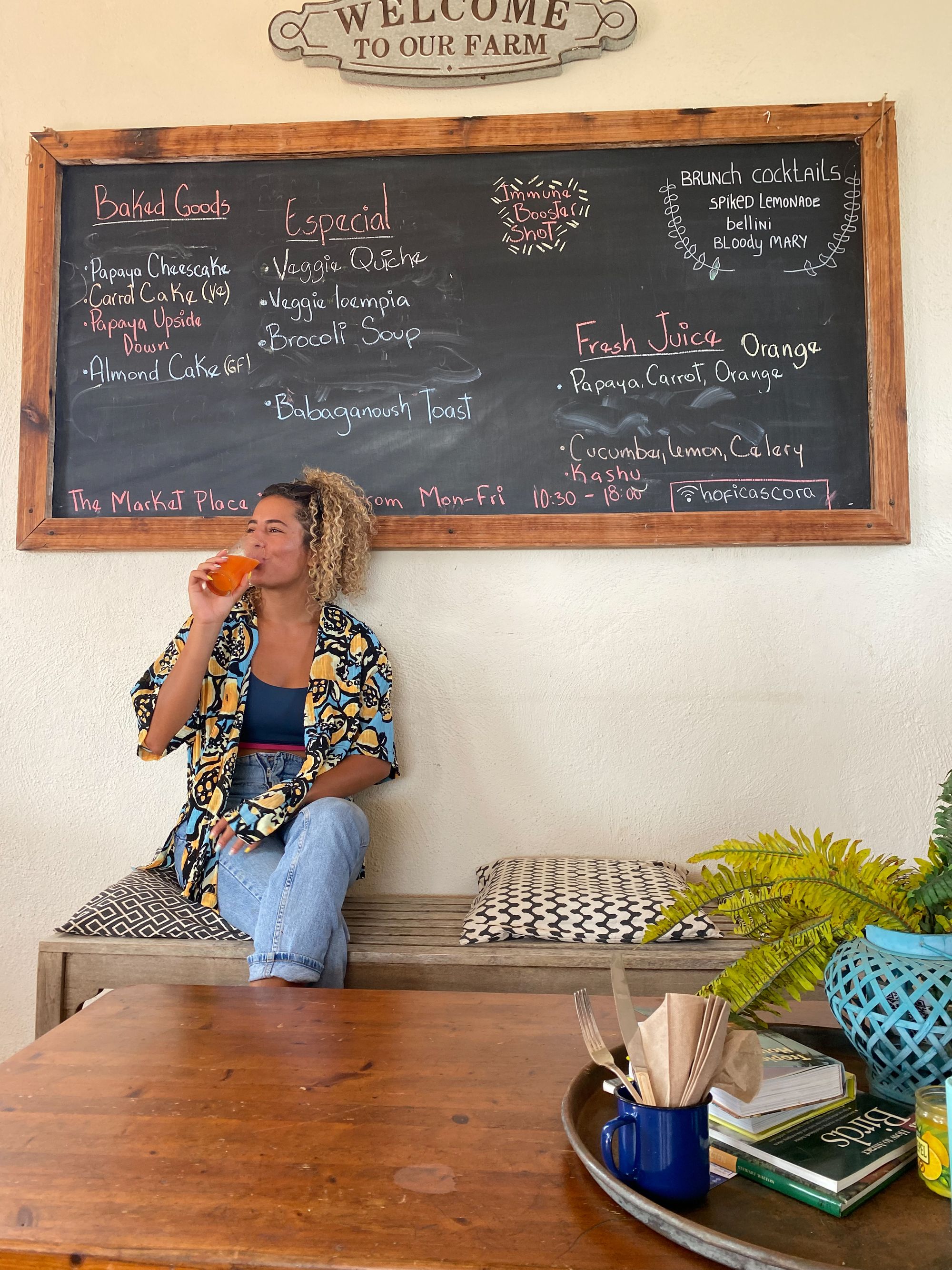 Woman sipping healthy drink at store