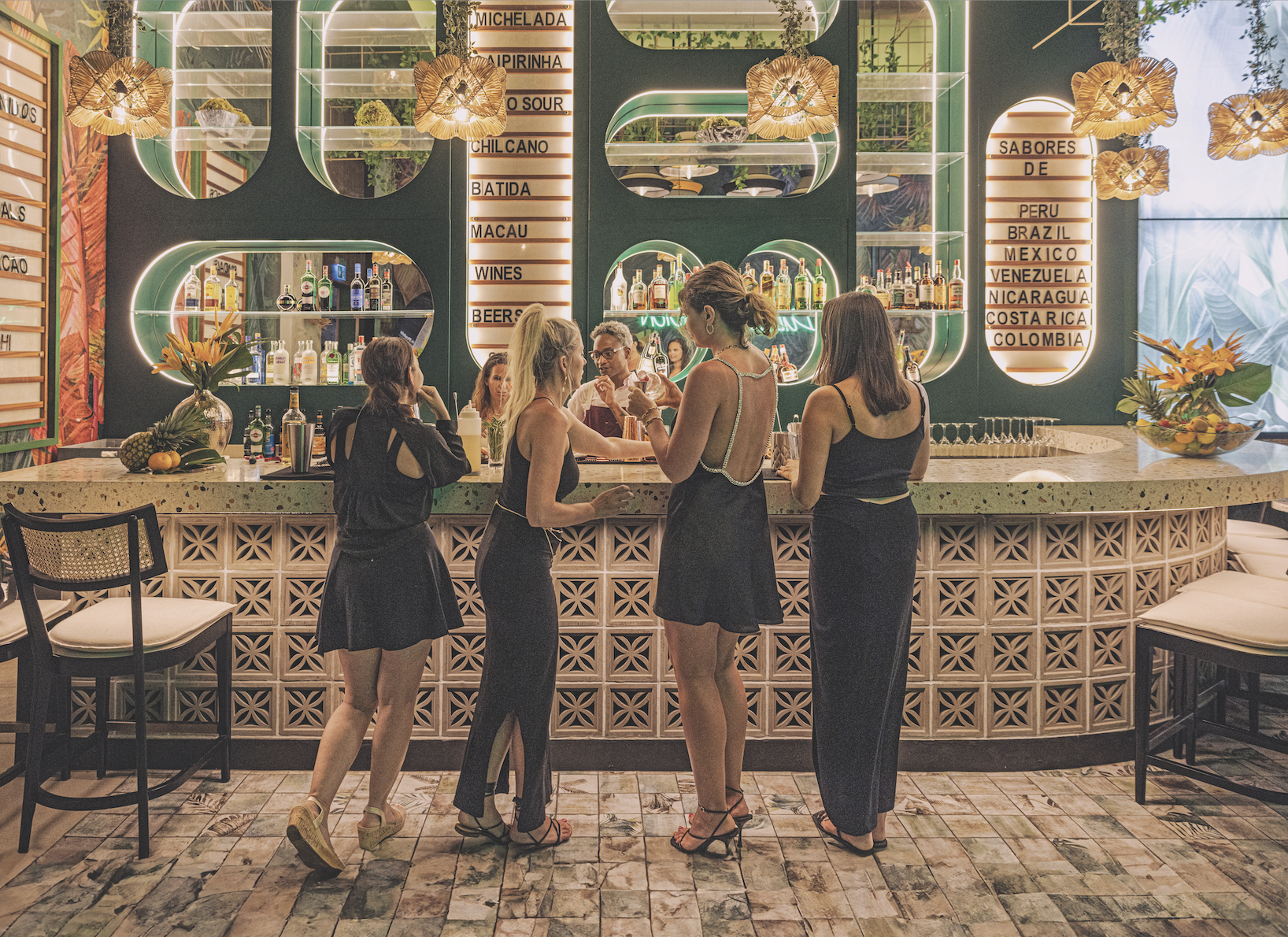 4 women at the bar