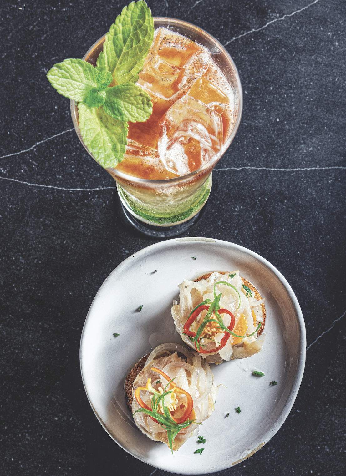 cocktails and canapés on black stone counter