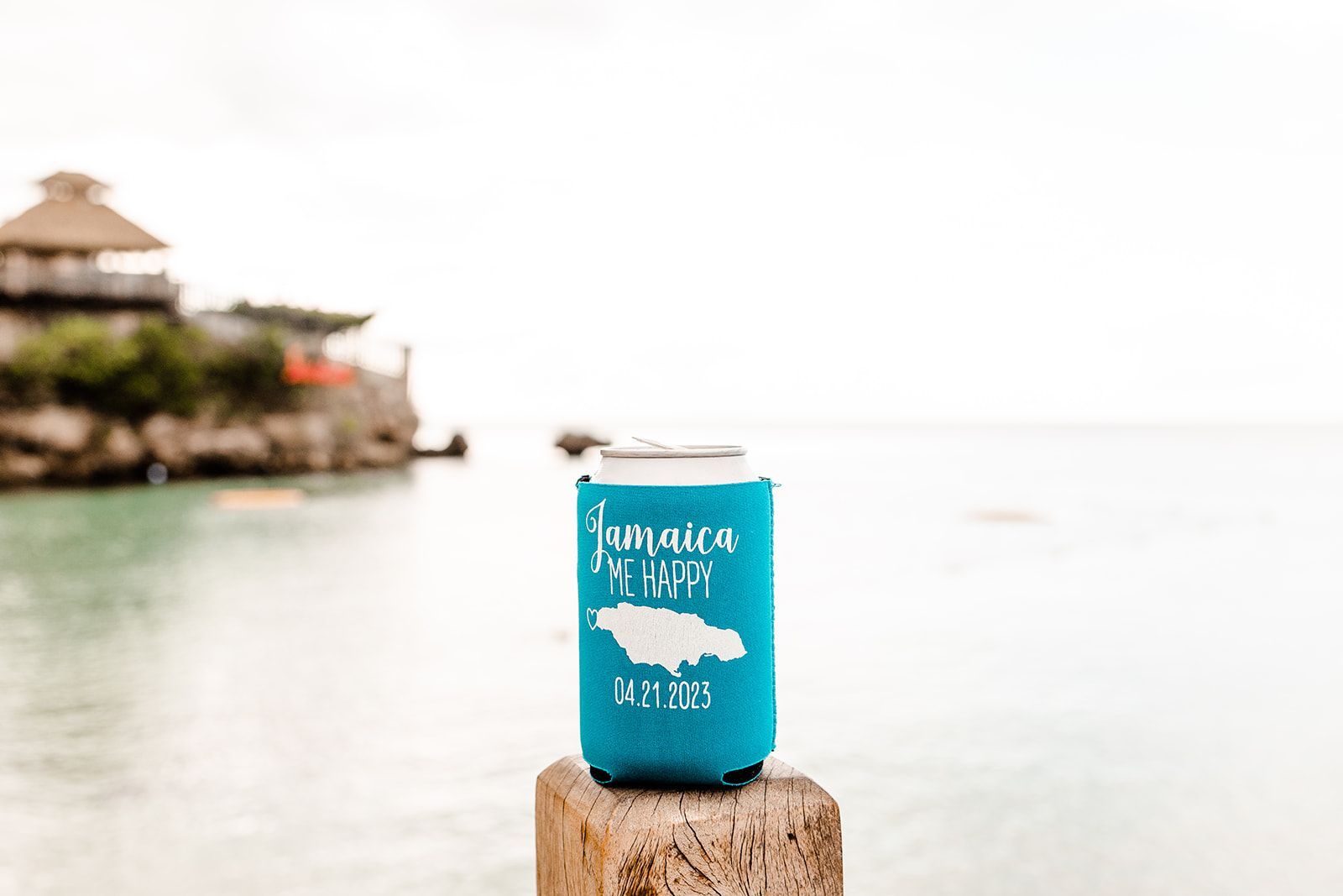 beer can in a koozie with jamaica me happy written on it take at sandals ochi resort