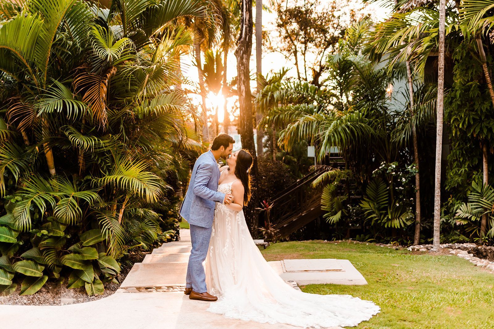 a bride and groom kissing at sandals ochi resort