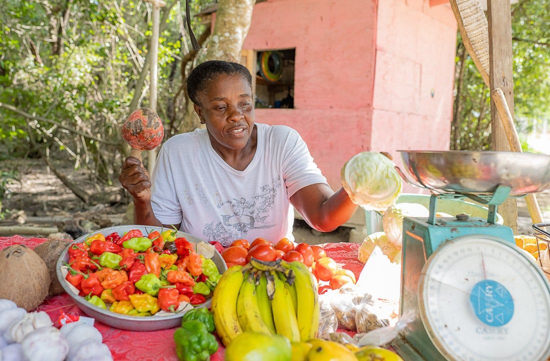 woman selling fresh local produce with scale