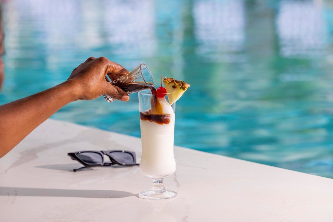 a blue mountain bomber being poured into a pina colada