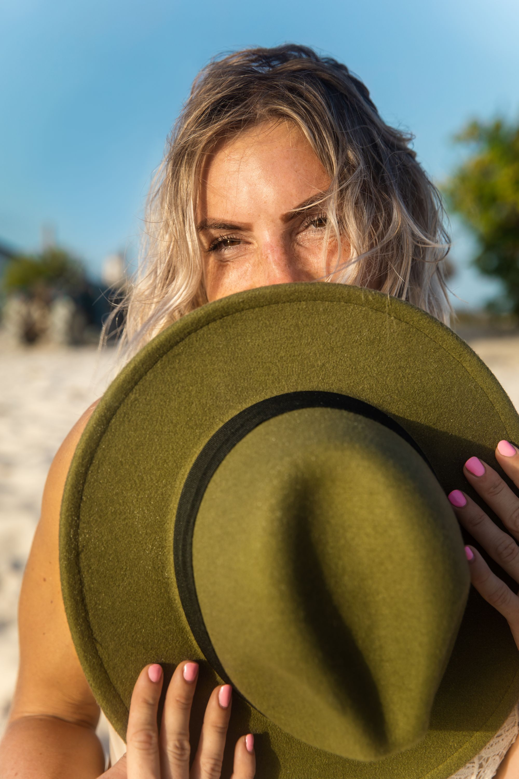 woman on beach with hat