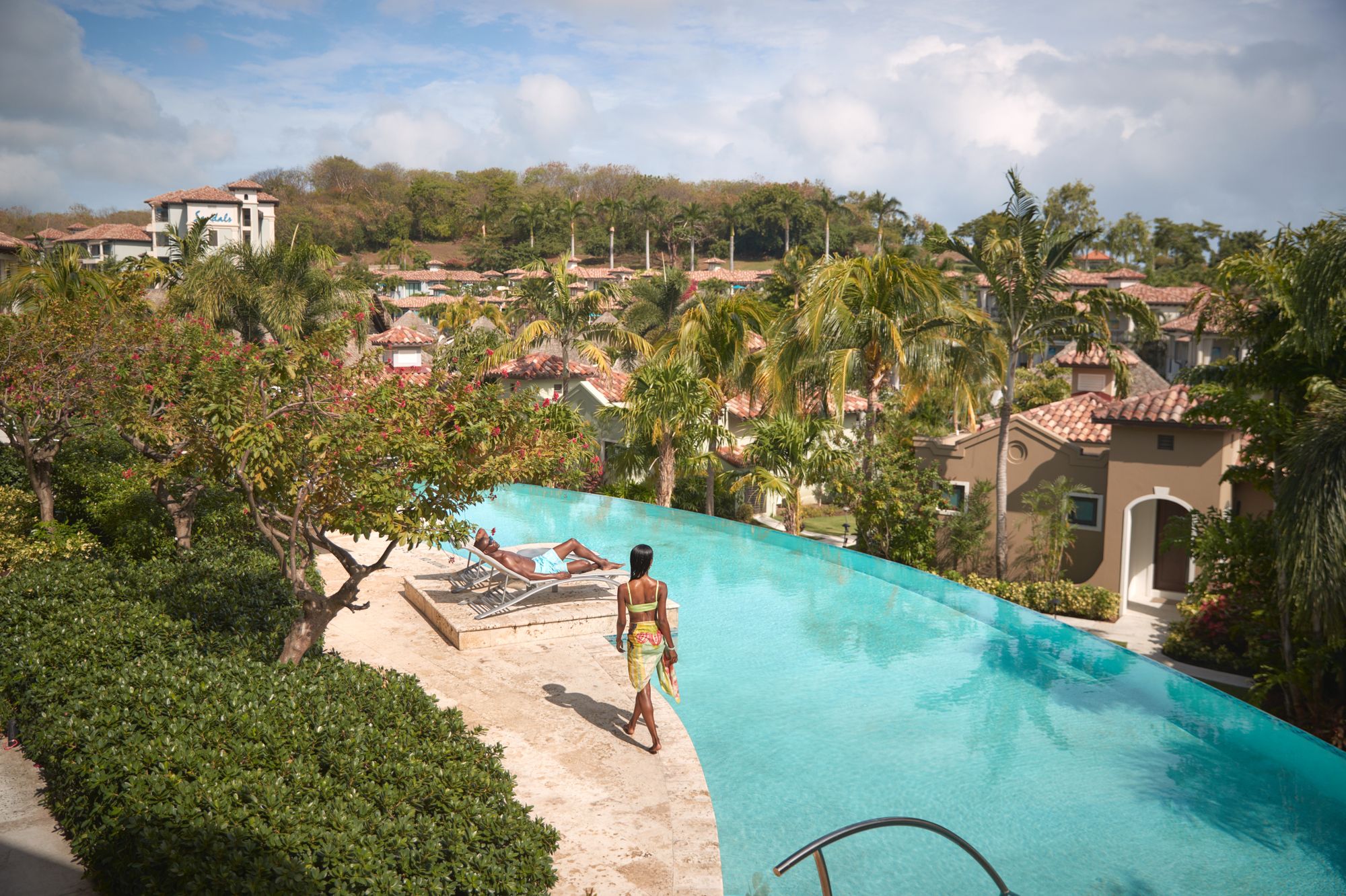 Woman walking by pool