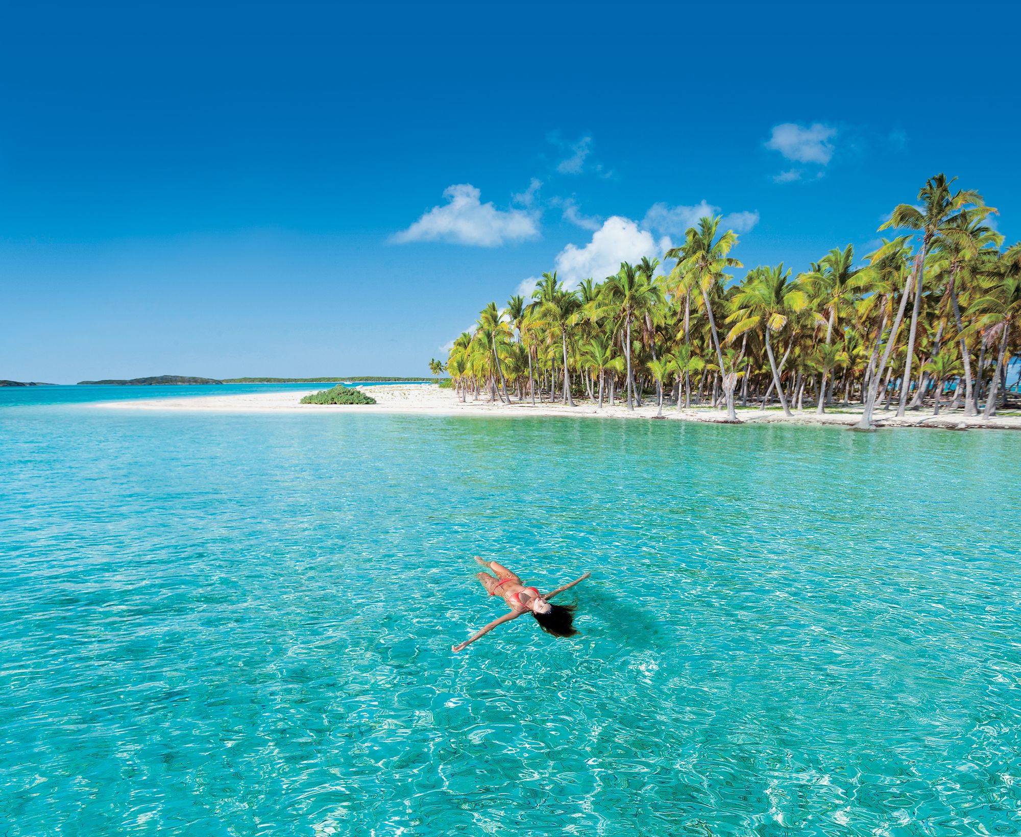 lady floating in ocean