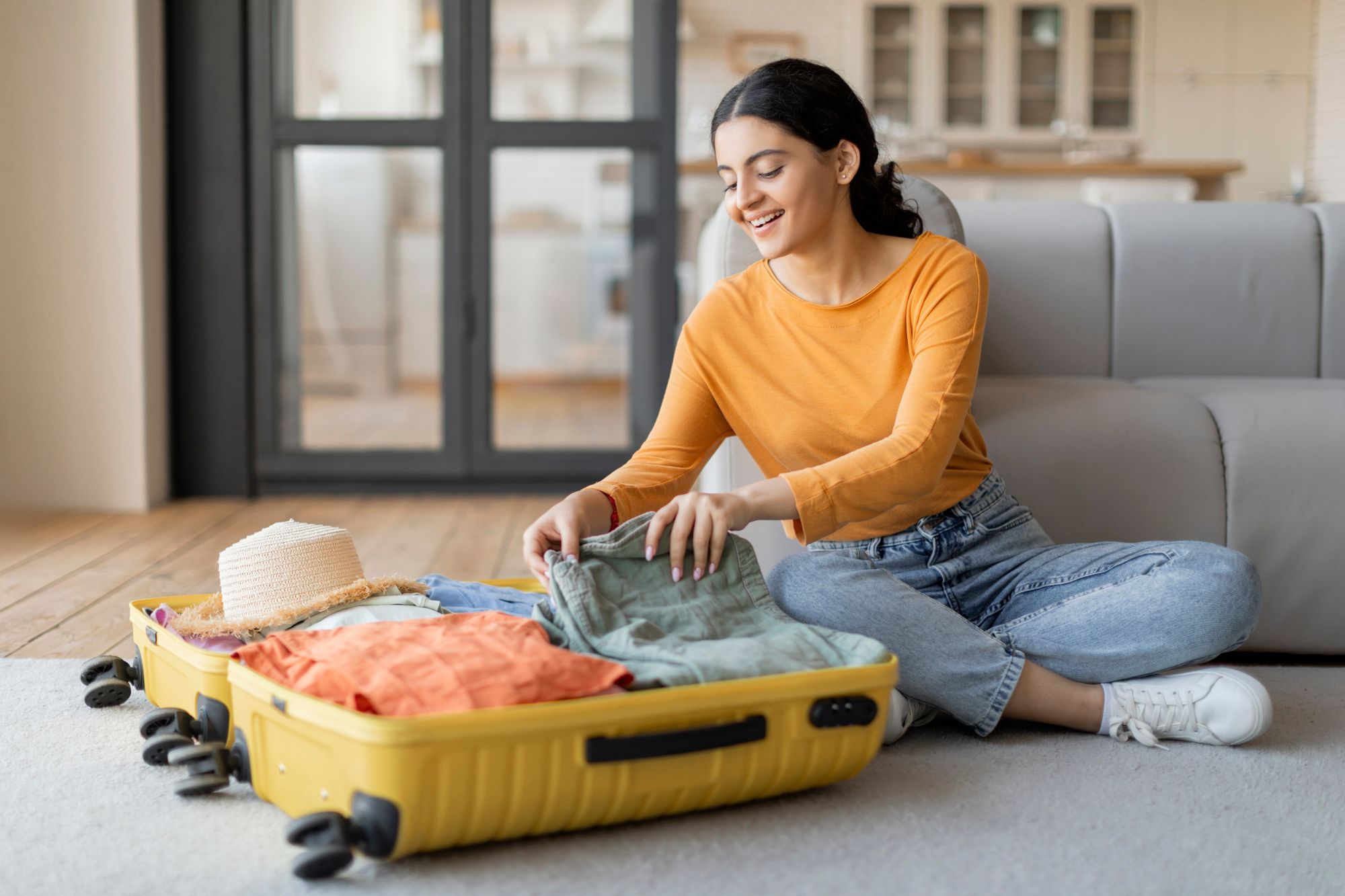 woman-packing-suitcase