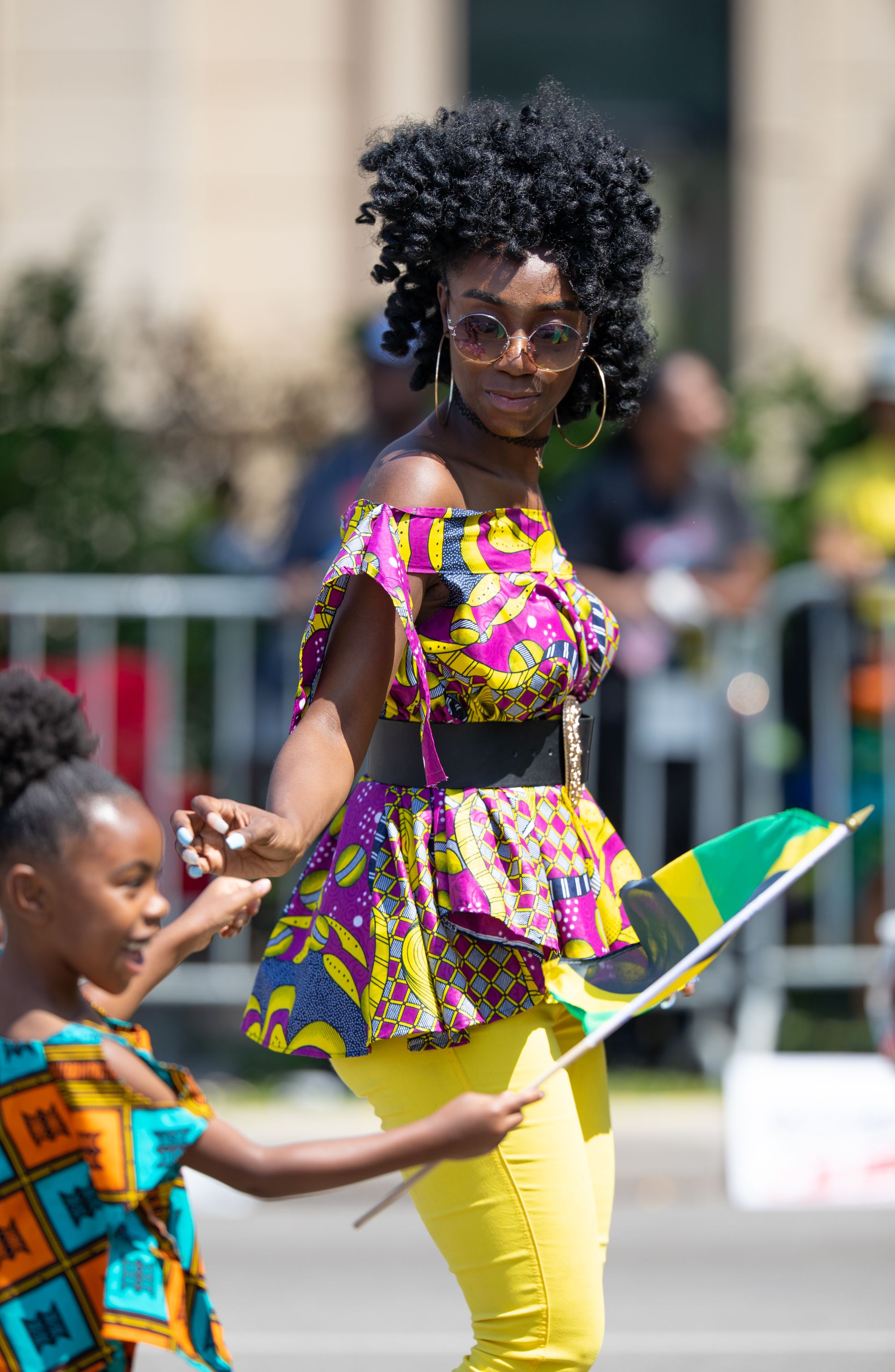 Jamaican woman and child with flag