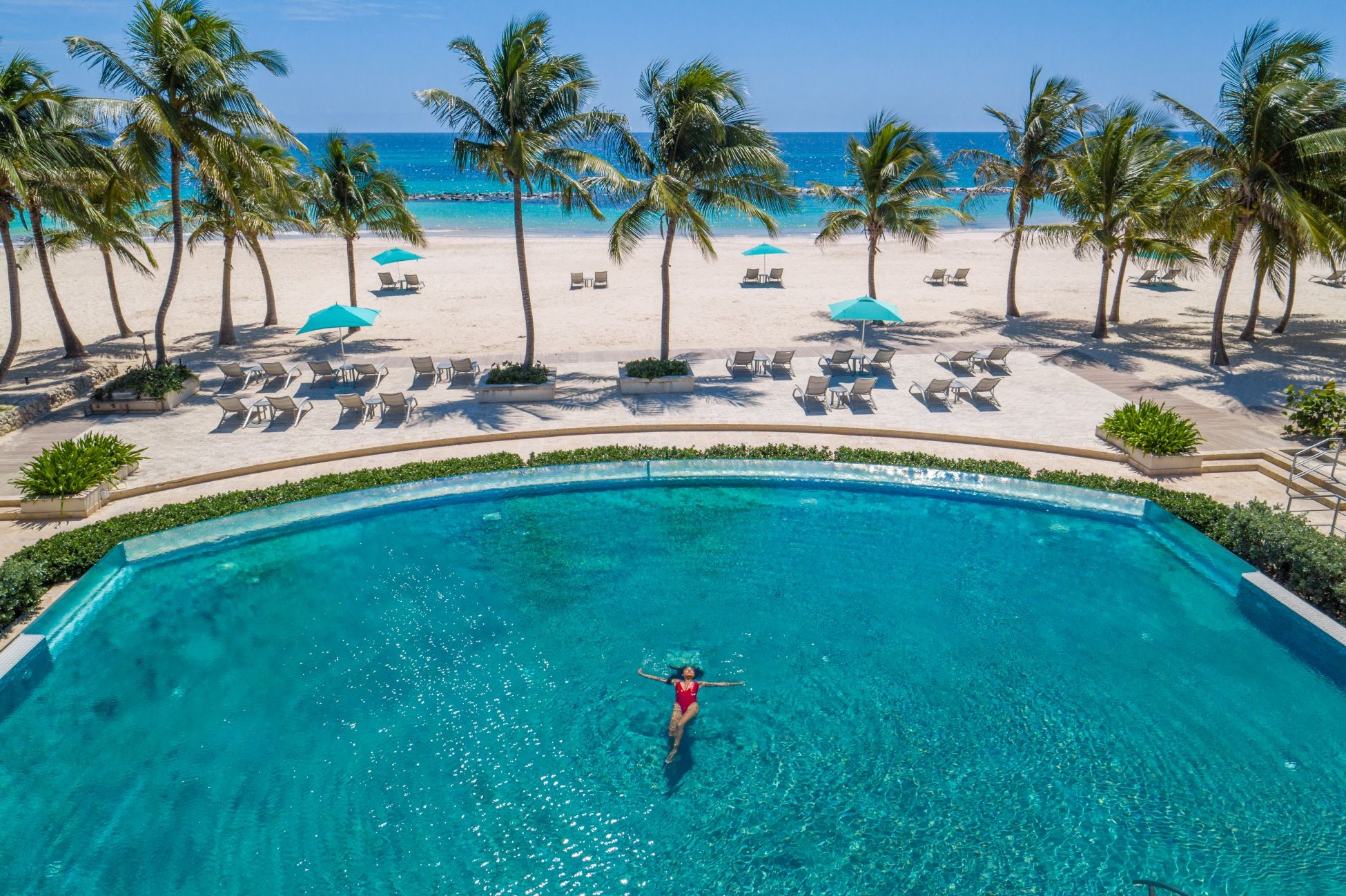 sandals-aerial-woman-in-pool-barbados-gbp-0226